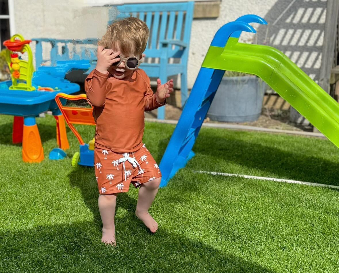 Kids wearing beige Retro Sunnies sunglasses outdoors for sun protection and style