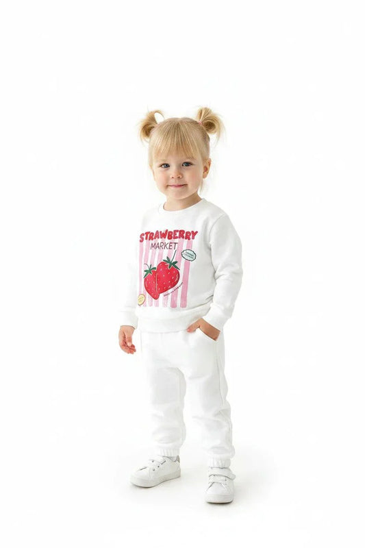 Child wearing strawberry pattern Strawberry Market Loungeset outdoors, cozy and playful summer outfit
