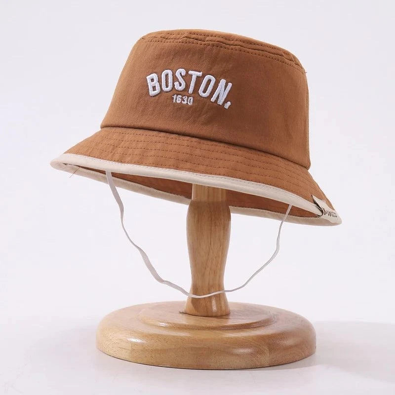 Child wearing Boston Bucket Hat outdoors with wide-brim sun protection