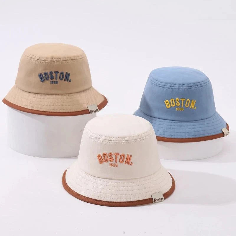 Toddler wearing Boston Bucket Hat with wide brim for sun protection outdoors