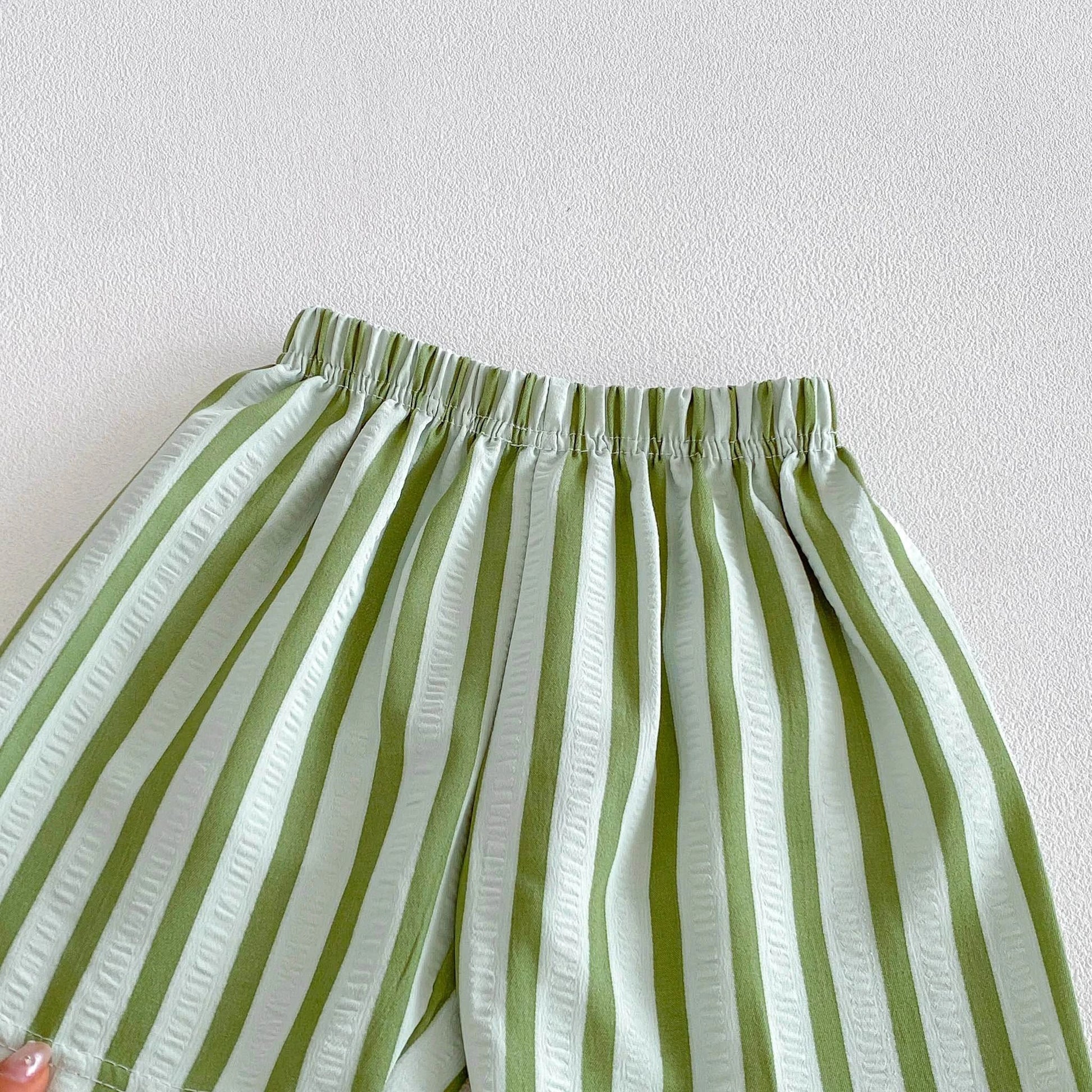 Kids wearing pinstripe casual shorts for summer activities